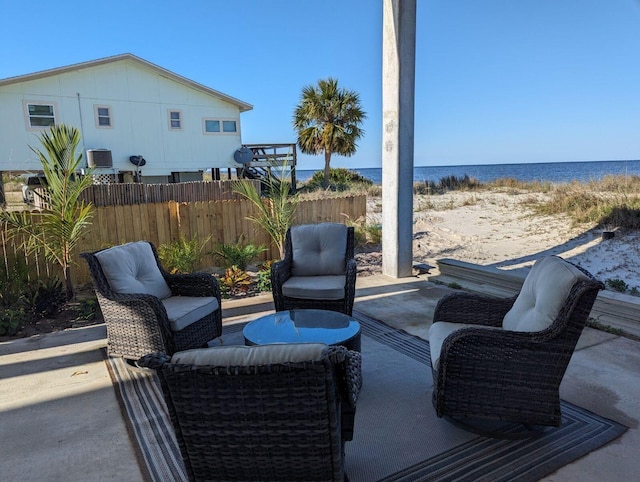 view of patio featuring a water view