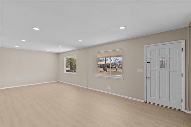 foyer entrance with light hardwood / wood-style flooring