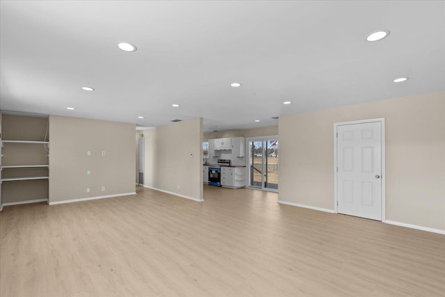 unfurnished living room featuring light hardwood / wood-style floors