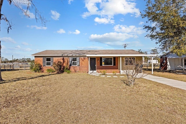 ranch-style house with a carport and a front yard