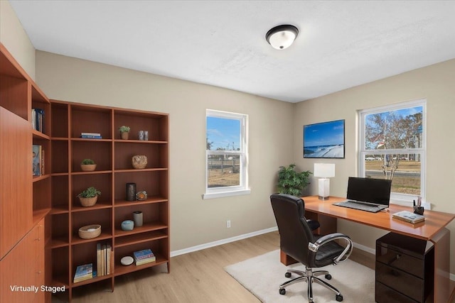 office with light hardwood / wood-style flooring