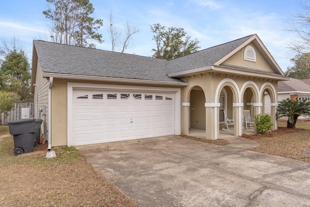 view of front facade with a garage and covered porch