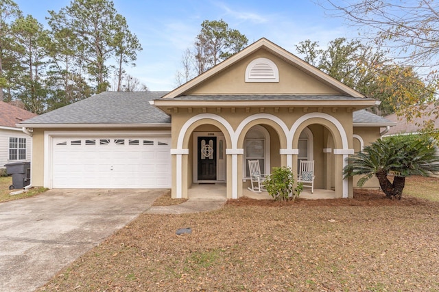 view of front of property featuring a garage and covered porch