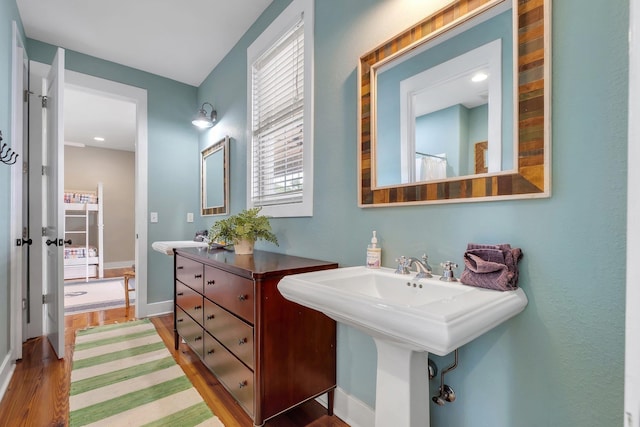 bathroom featuring hardwood / wood-style flooring and sink