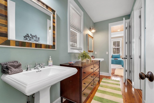 bathroom featuring sink and hardwood / wood-style floors