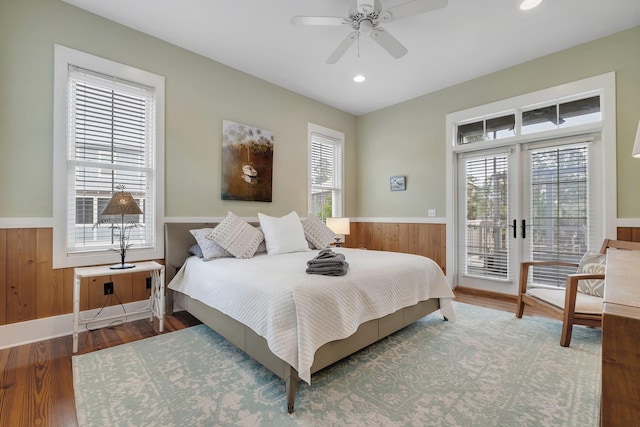 bedroom featuring hardwood / wood-style flooring, ceiling fan, french doors, and access to exterior