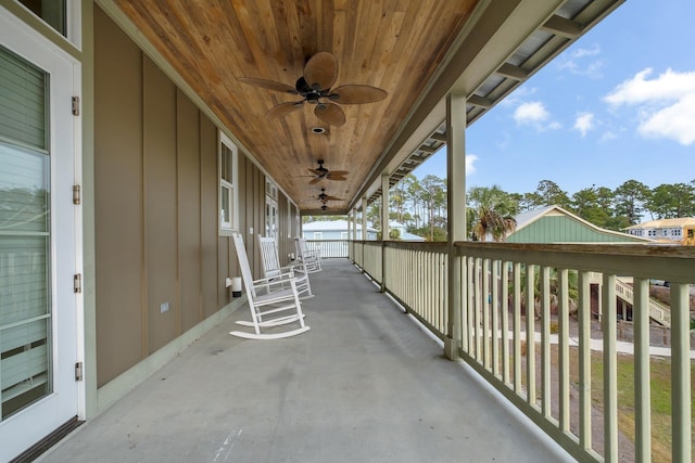 balcony with ceiling fan and a porch