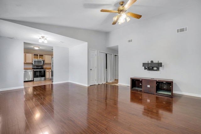1541 San Luis Rd, Tallahassee, FL 32304 - unfurnished living room featuring ceiling fan, lofted ceiling, wood finished floors, and visible vents