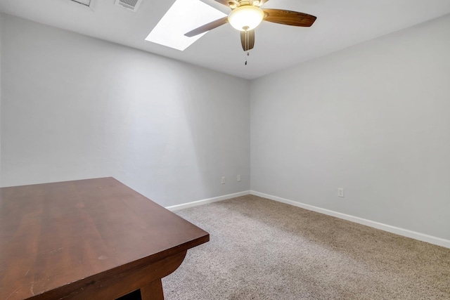 1541 San Luis Rd, Tallahassee, FL 32304 - carpeted empty room with a ceiling fan, baseboards, and a skylight
