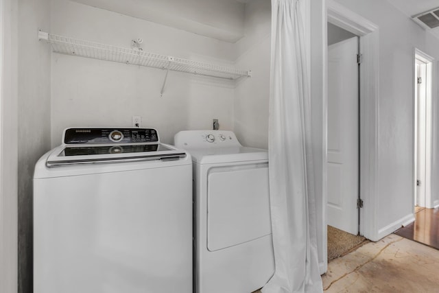 1541 San Luis Rd, Tallahassee, FL 32304 - laundry area featuring laundry area, baseboards, washer and dryer, and visible vents
