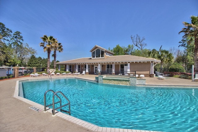 view of swimming pool with a patio area