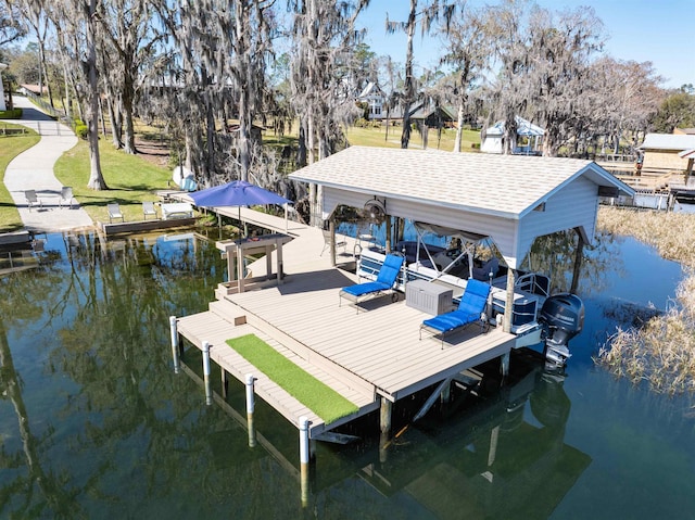 dock area with boat lift and a water view