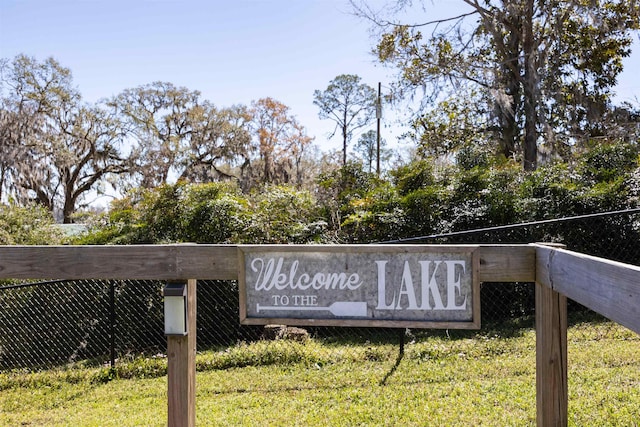 community sign with fence