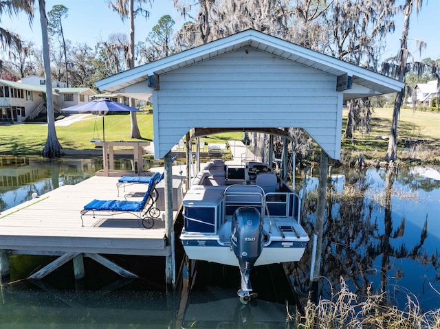 view of dock with a lawn and a water view