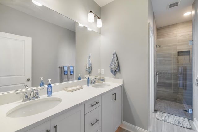 bathroom with vanity and an enclosed shower