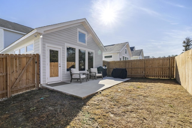 back of property with a patio