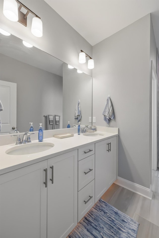 bathroom featuring vanity and hardwood / wood-style floors