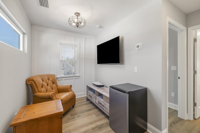 sitting room featuring light hardwood / wood-style floors