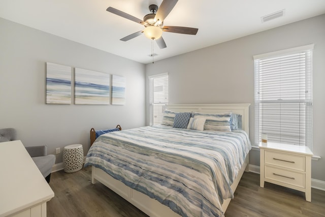 bedroom featuring ceiling fan and dark hardwood / wood-style flooring