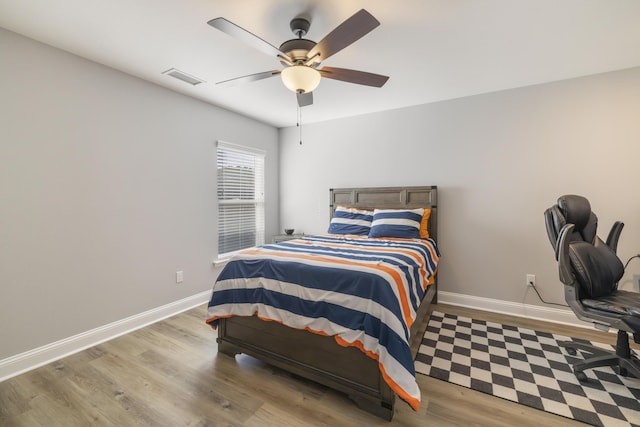 bedroom featuring light hardwood / wood-style flooring and ceiling fan