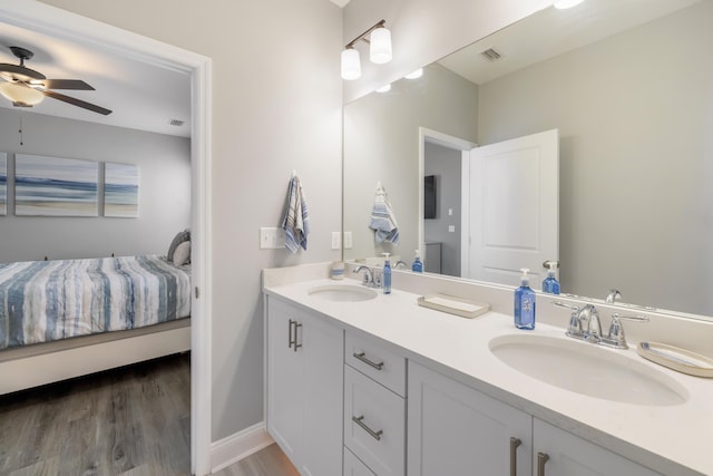 bathroom with vanity, wood-type flooring, and ceiling fan