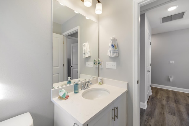 bathroom featuring vanity and hardwood / wood-style floors