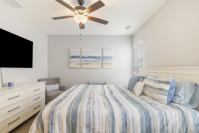 bedroom featuring dark hardwood / wood-style floors and ceiling fan