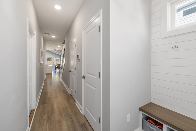 corridor with wood-type flooring