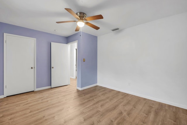 unfurnished bedroom with ceiling fan and light hardwood / wood-style flooring