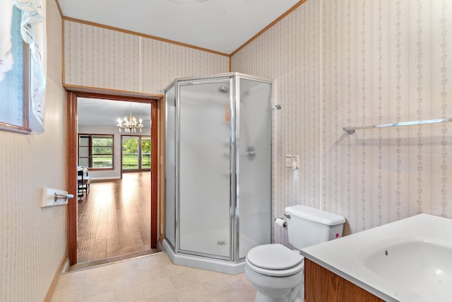 bathroom with vanity, ornamental molding, an enclosed shower, and toilet