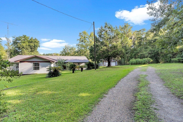 view of yard featuring a garage