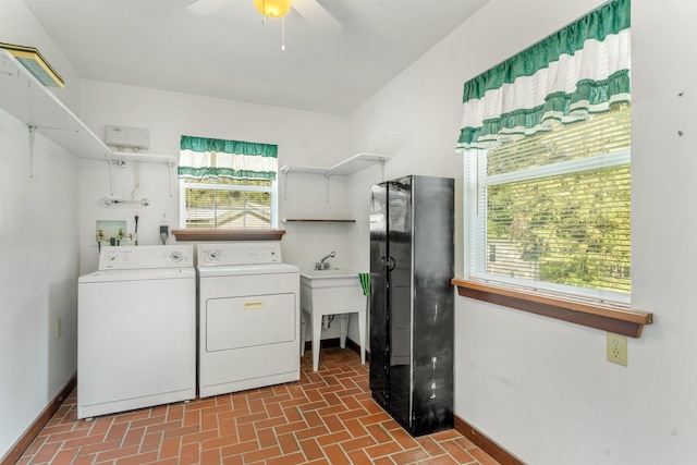 washroom with washer and dryer and ceiling fan