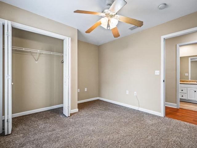 unfurnished bedroom with ceiling fan, a closet, and carpet