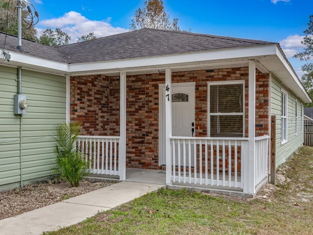 doorway to property featuring covered porch