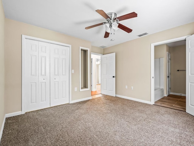 unfurnished bedroom featuring carpet flooring, ceiling fan, and a closet