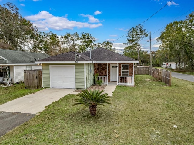 ranch-style house featuring a front lawn, covered porch, and a garage