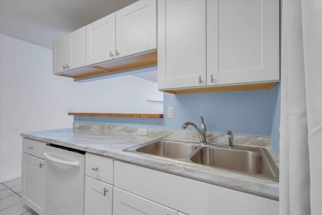 787 E Timberwood Cir, Tallahassee, FL 32304 - kitchen featuring a sink, light countertops, and white cabinetry
