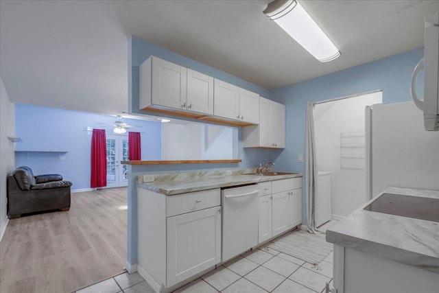 787 E Timberwood Cir, Tallahassee, FL 32304 - kitchen featuring dishwasher, freestanding refrigerator, a sink, white cabinetry, and ceiling fan