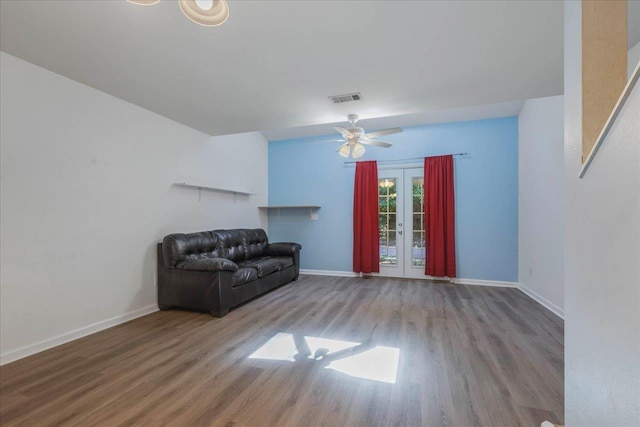 787 E Timberwood Cir, Tallahassee, FL 32304 - unfurnished living room with wood finished floors, french doors, baseboards, and a ceiling fan