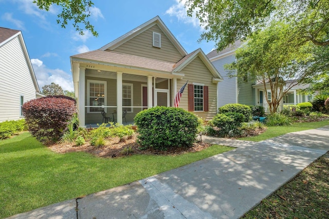 3248 Newberry Blvd, Tallahassee, FL 32311 - view of front of property with a shingled roof and a front lawn