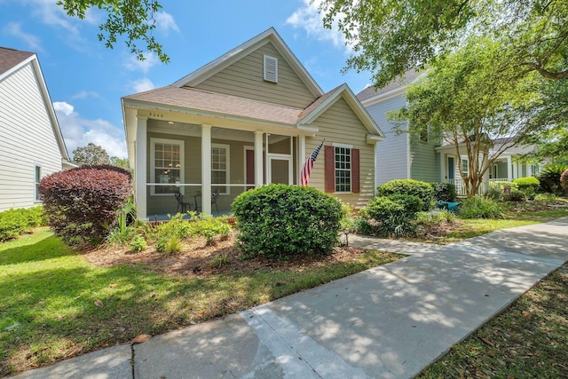 3248 Newberry Blvd, Tallahassee, FL 32311 - view of front facade featuring a shingled roof and a front lawn
