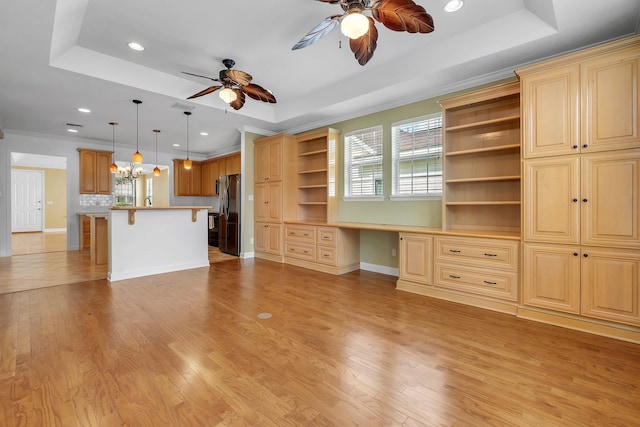 3248 Newberry Blvd, Tallahassee, FL 32311 - unfurnished living room featuring a ceiling fan, a tray ceiling, recessed lighting, light wood-style floors, and a chandelier