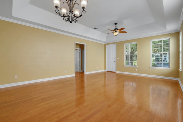 3248 Newberry Blvd, Tallahassee, FL 32311 - unfurnished room featuring a raised ceiling, light wood-style flooring, a ceiling fan, a chandelier, and baseboards