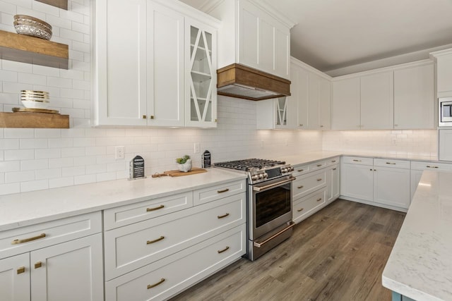 kitchen with stainless steel appliances, white cabinets, glass insert cabinets, and open shelves