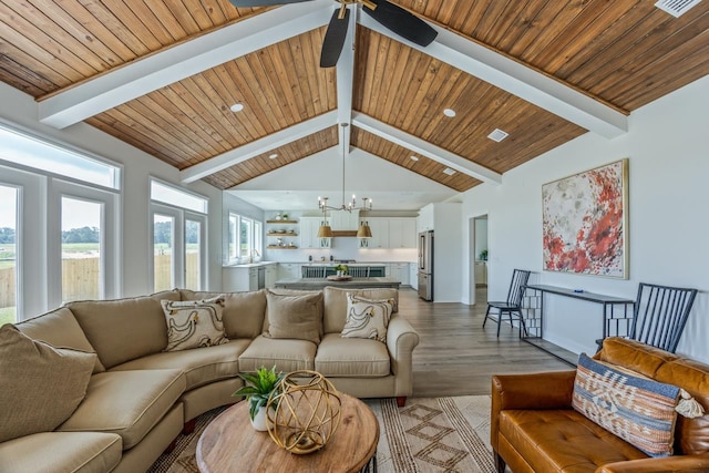 living room with high vaulted ceiling, wooden ceiling, beamed ceiling, and light wood-style flooring