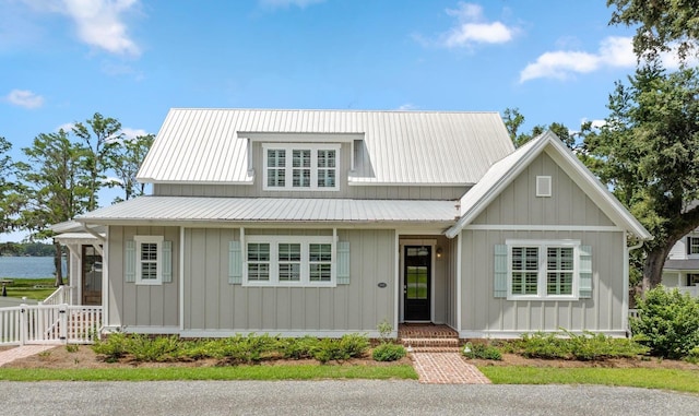 2845 NE Cherry Lake Cir, Pinetta Madison County, FL 32350 - view of front of house featuring metal roof and fence