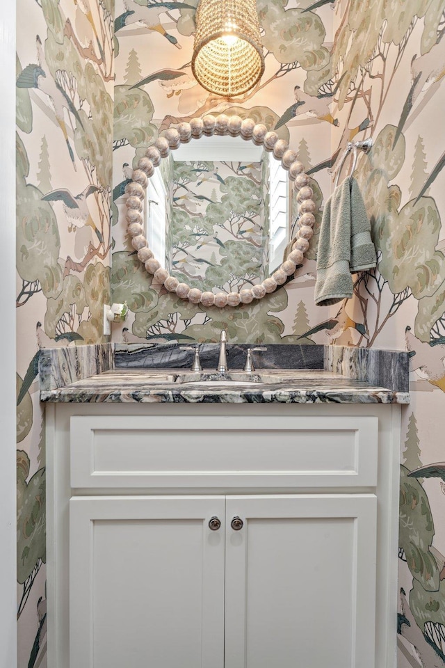2845 NE Cherry Lake Cir, Pinetta Madison County, FL 32350 - bathroom with vanity, a chandelier, and wallpapered walls