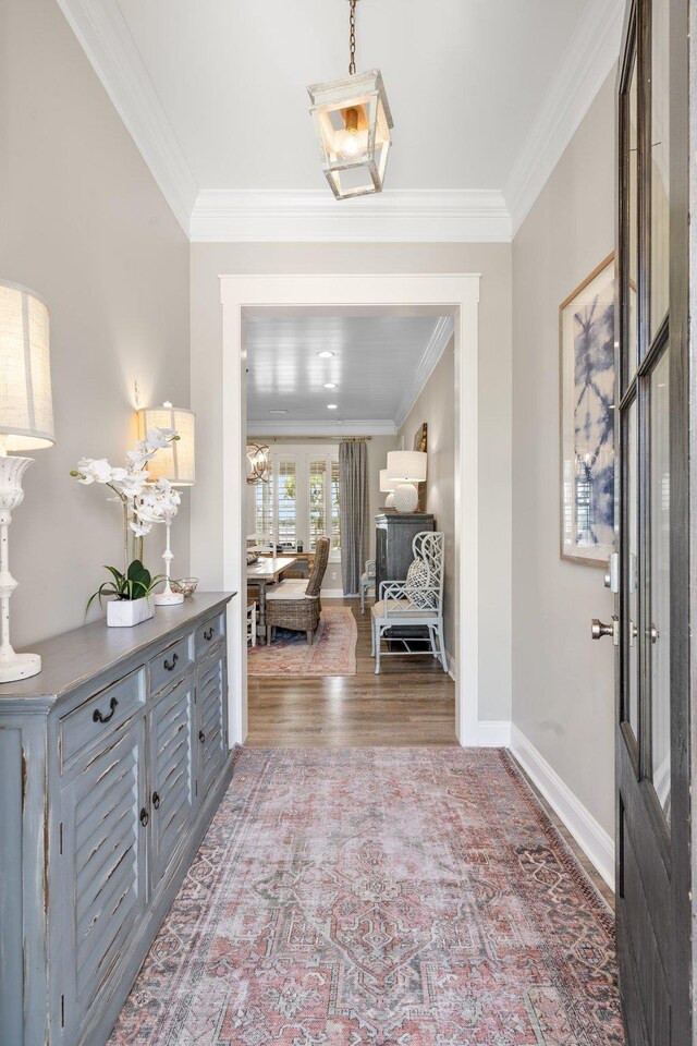 2845 NE Cherry Lake Cir, Pinetta Madison County, FL 32350 - entryway with crown molding, wood finished floors, baseboards, and a chandelier