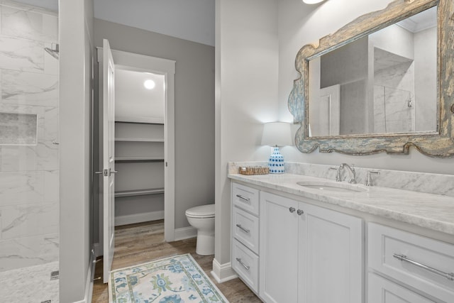 2845 NE Cherry Lake Cir, Pinetta Madison County, FL 32350 - bathroom with a marble finish shower, vanity, toilet, and wood finished floors