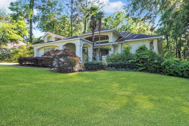 2757 W Hannon Hill Dr, Tallahassee, FL 32309 - view of front of home with a front lawn and stucco siding